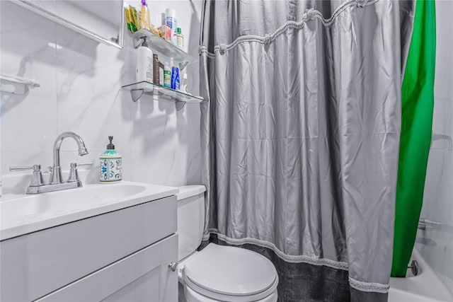 full bathroom with toilet and vanity