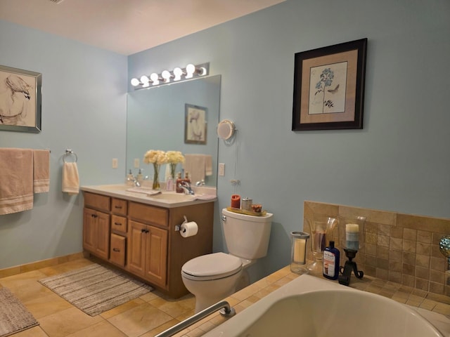 full bathroom with a garden tub, toilet, a sink, baseboards, and double vanity