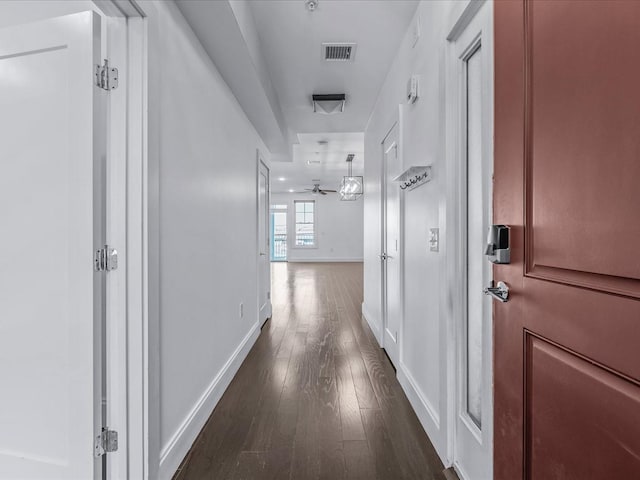 141 Marina Pointe Dr, East Rockaway, NY 11518 - hall with dark wood-style floors, baseboards, and visible vents
