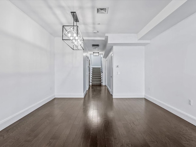 141 Marina Pointe Dr, East Rockaway, NY 11518 - unfurnished dining area with visible vents, dark wood finished floors, stairway, and baseboards