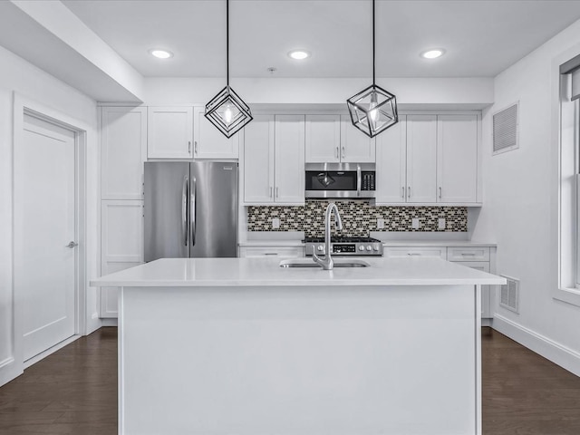 141 Marina Pointe Dr, East Rockaway, NY 11518 - kitchen featuring visible vents, an island with sink, appliances with stainless steel finishes, light countertops, and pendant lighting