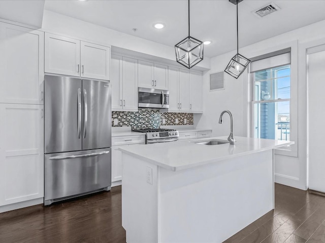141 Marina Pointe Dr, East Rockaway, NY 11518 - kitchen with an island with sink, white cabinets, and stainless steel appliances