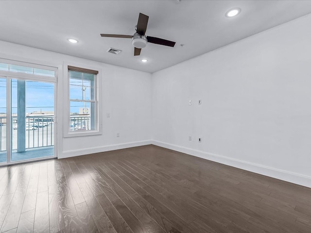 141 Marina Pointe Dr, East Rockaway, NY 11518 - unfurnished room with baseboards, visible vents, dark wood finished floors, and recessed lighting