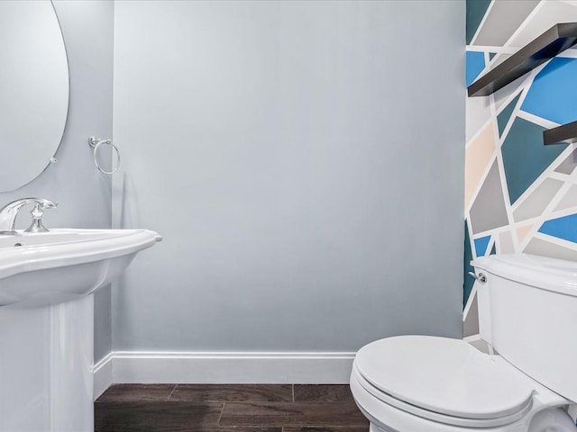 141 Marina Pointe Dr, East Rockaway, NY 11518 - bathroom featuring wood tiled floor, baseboards, a sink, and toilet
