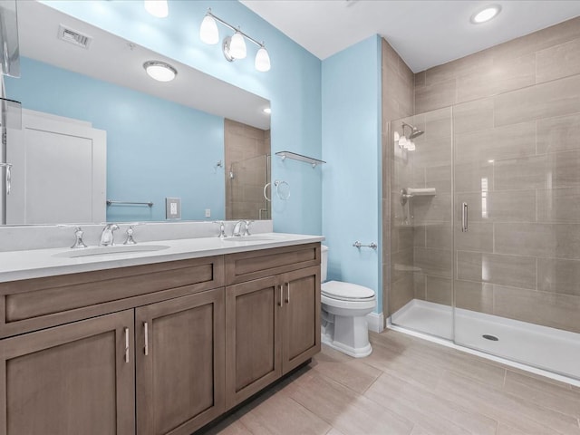 141 Marina Pointe Dr, East Rockaway, NY 11518 - full bath featuring toilet, a sink, visible vents, and a shower stall