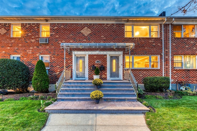 view of front of house featuring brick siding