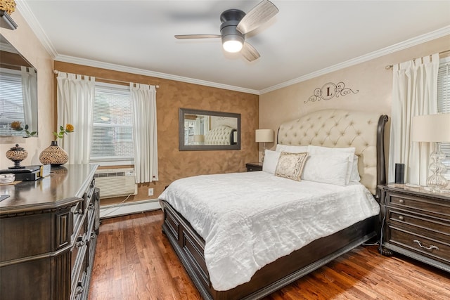 bedroom featuring ceiling fan, ornamental molding, baseboard heating, and dark wood finished floors