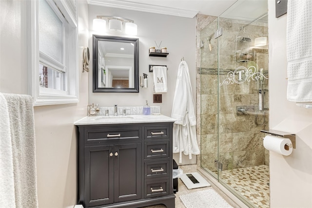 full bath with a shower stall, crown molding, and vanity