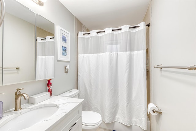 bathroom with shower / bath combo, vanity, and toilet