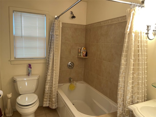 full bathroom with toilet, shower / tub combo, and tile patterned flooring