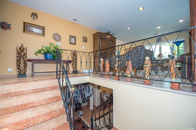 stairway featuring recessed lighting and visible vents