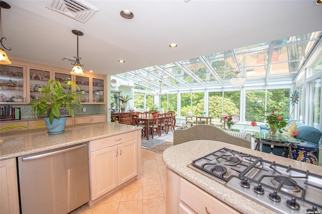 kitchen featuring light tile patterned floors, a sunroom, visible vents, appliances with stainless steel finishes, and glass insert cabinets