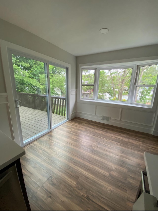 unfurnished sunroom with visible vents