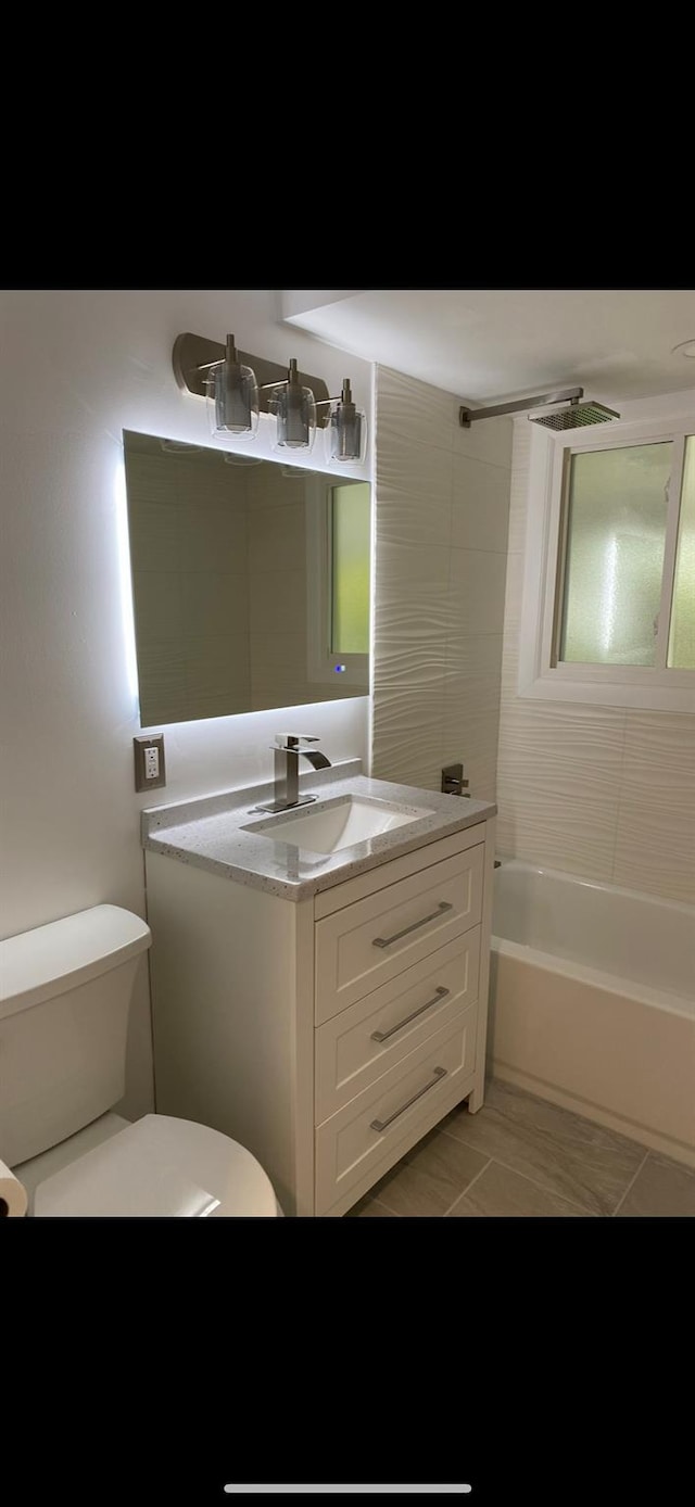 full bath featuring toilet,  shower combination, and vanity