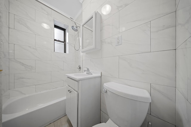 bathroom featuring  shower combination, tile walls, vanity, and toilet