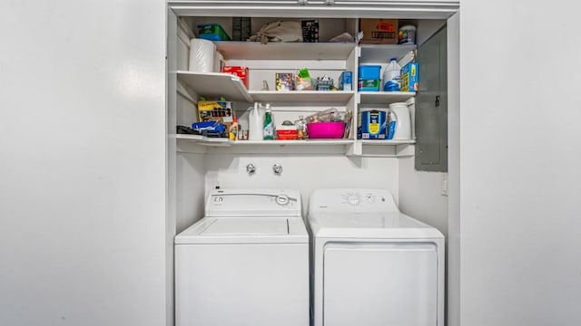 washroom with laundry area and washer and dryer