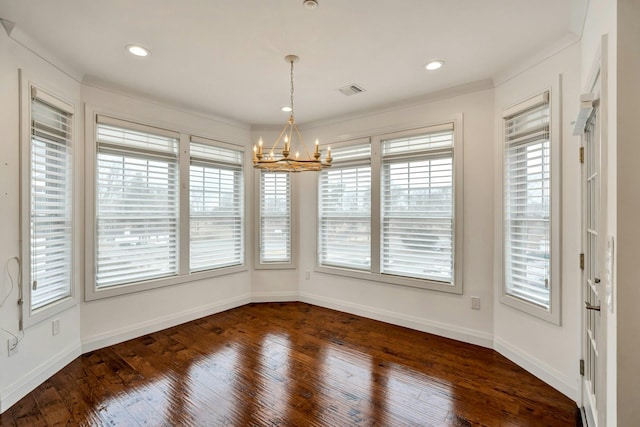 unfurnished dining area with dark wood-style floors, recessed lighting, visible vents, a chandelier, and baseboards