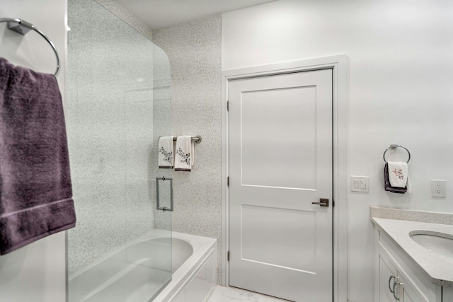 bathroom featuring marble finish floor, vanity, and shower / bathtub combination