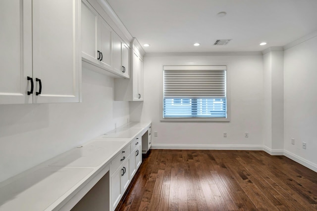 interior space with baseboards, visible vents, dark wood-type flooring, white cabinetry, and recessed lighting