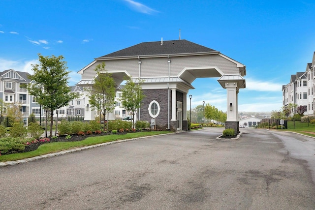 view of street with curbs and a residential view