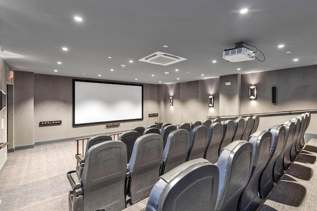 cinema room with recessed lighting, visible vents, and light colored carpet