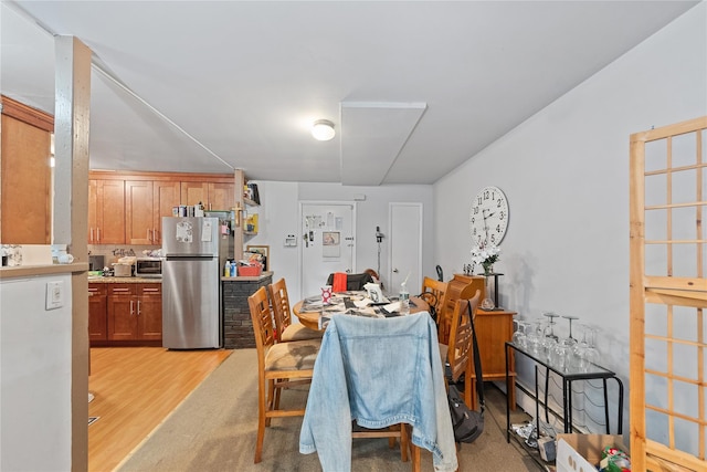 dining room featuring light wood-style flooring