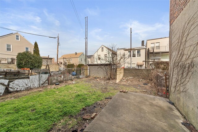 view of yard featuring a patio area and fence