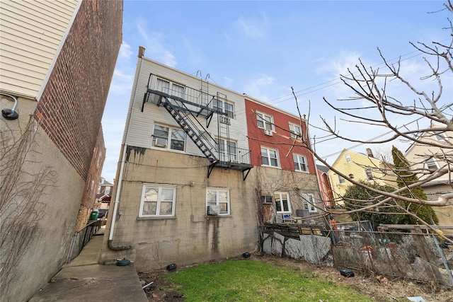 view of building exterior with fence