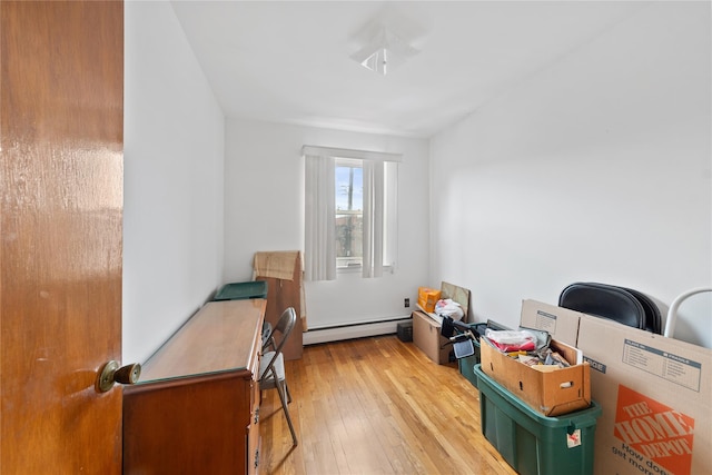 interior space with light wood-style floors and a baseboard radiator