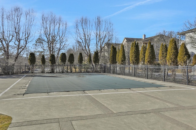 view of swimming pool featuring a fenced in pool, a patio area, and fence