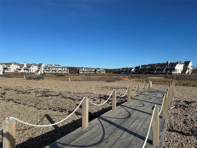 view of dock with a residential view