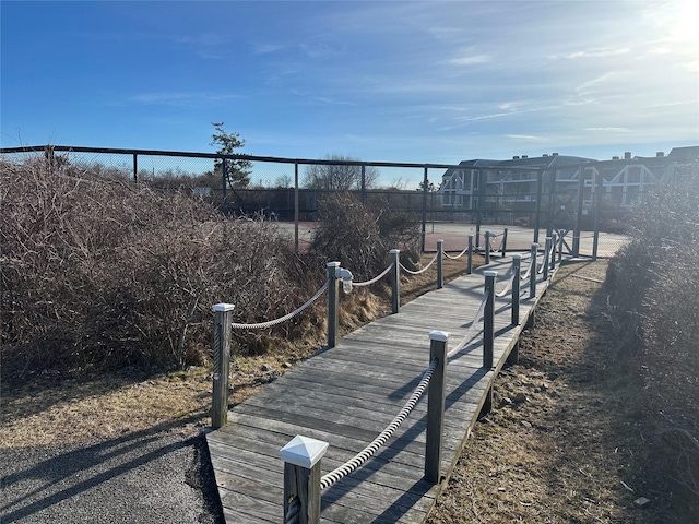 view of community with fence