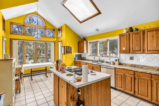 kitchen with white electric stovetop, lofted ceiling, baseboard heating, stainless steel dishwasher, and light tile patterned flooring