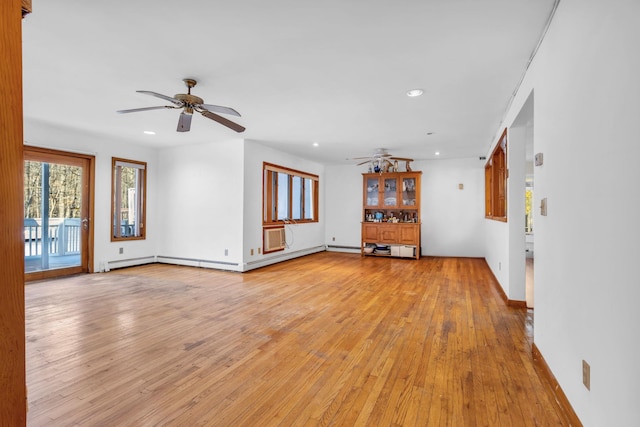 unfurnished living room featuring ceiling fan, light wood-type flooring, and recessed lighting