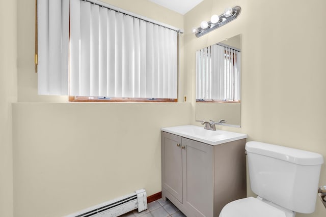 bathroom featuring a baseboard radiator, vanity, toilet, and tile patterned floors