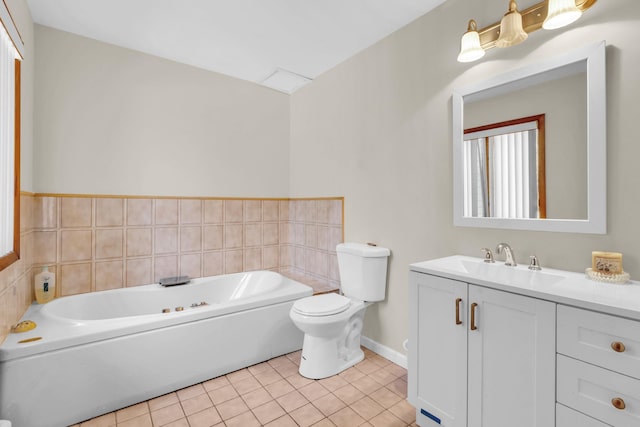 bathroom with toilet, tile patterned flooring, a bath, and vanity
