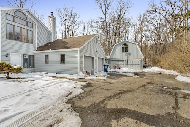 exterior space with a detached garage
