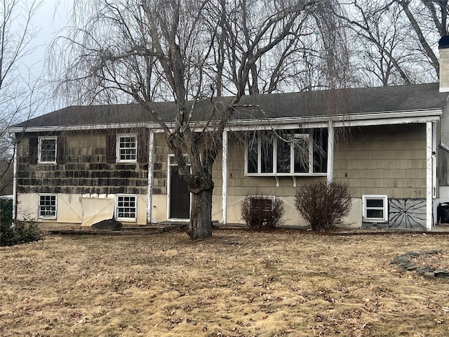 view of front facade featuring a chimney