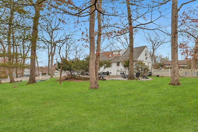 view of yard with a residential view and a fenced backyard