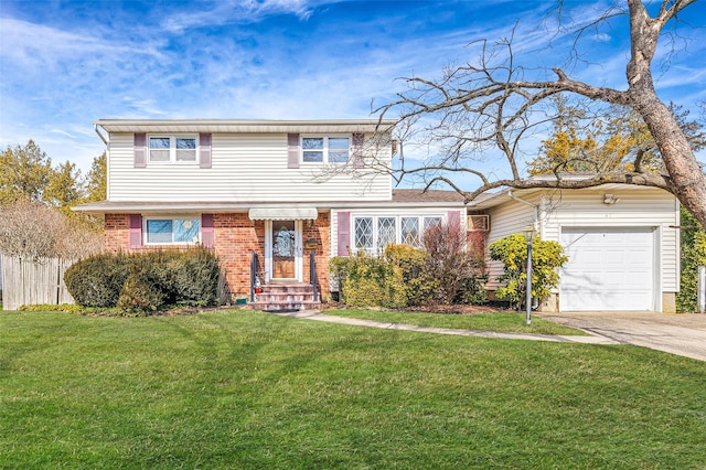 view of front of home with driveway, an attached garage, fence, a front lawn, and brick siding