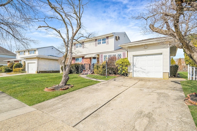 traditional-style home featuring an attached garage, driveway, and a front lawn