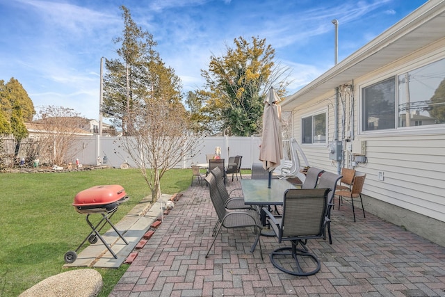 view of patio / terrace with a fenced backyard, a grill, and outdoor dining area