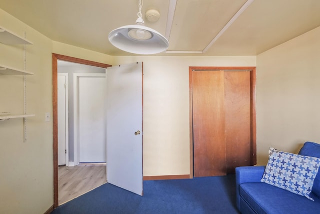 living area featuring baseboards