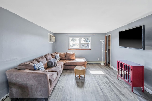 living room with light wood-style floors, a baseboard heating unit, and baseboards