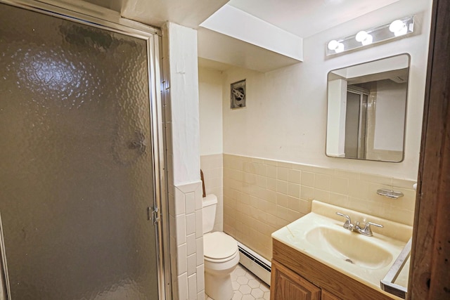 full bath with toilet, baseboard heating, vanity, a shower stall, and tile walls