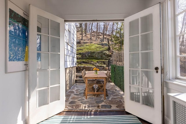 doorway to outside with wood finished floors