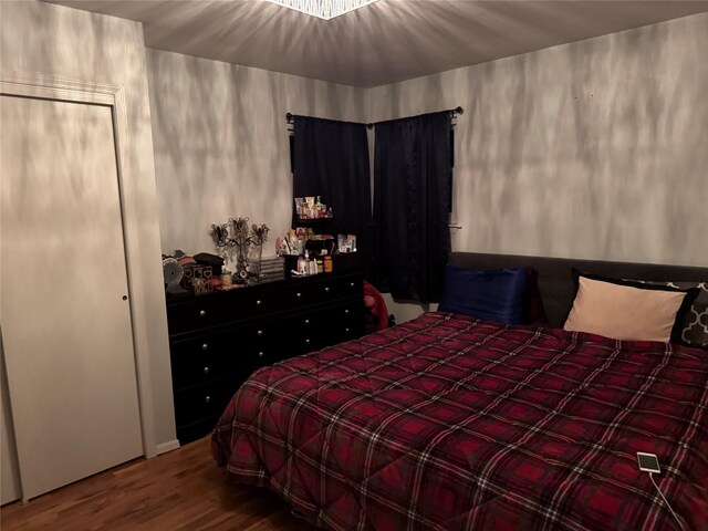 bedroom with wood finished floors