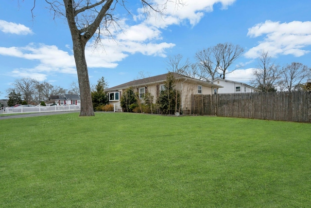 view of yard with fence