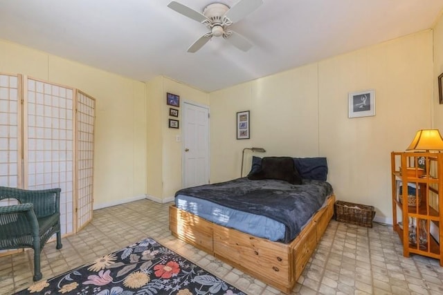 bedroom featuring ceiling fan and tile patterned floors