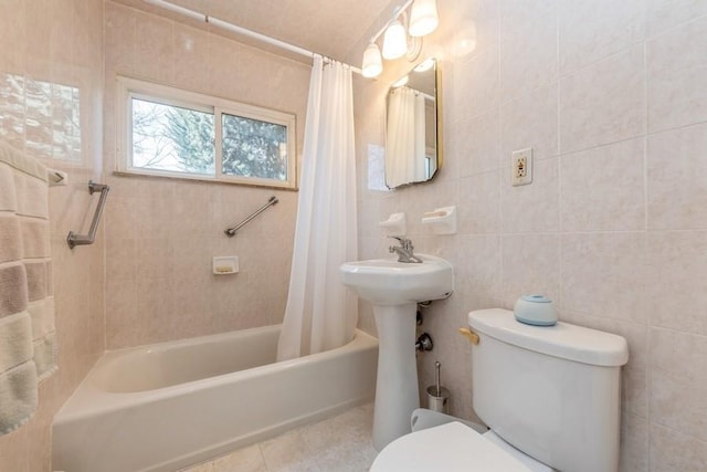 full bathroom with shower / tub combo, tile walls, toilet, and tile patterned floors